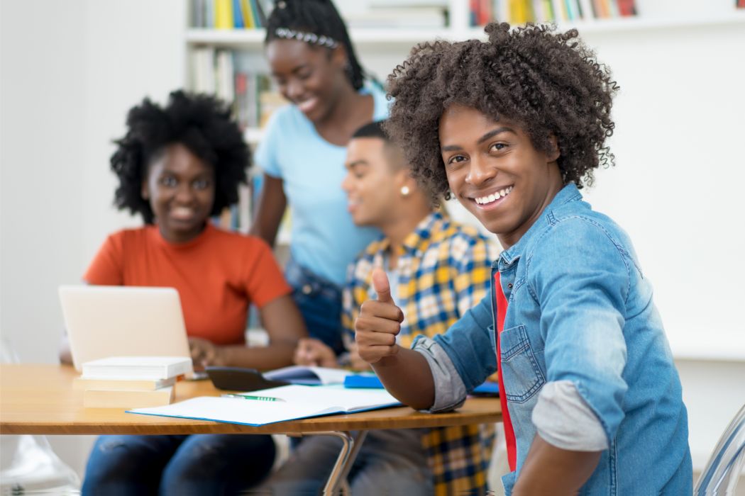 Student giving the thumbs up sign
